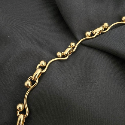 Collier Chaine Dorée Maille Sinueuse et Boule Sphère Effet Brillant